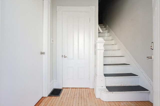 stairs with wood-type flooring