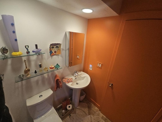 bathroom featuring toilet