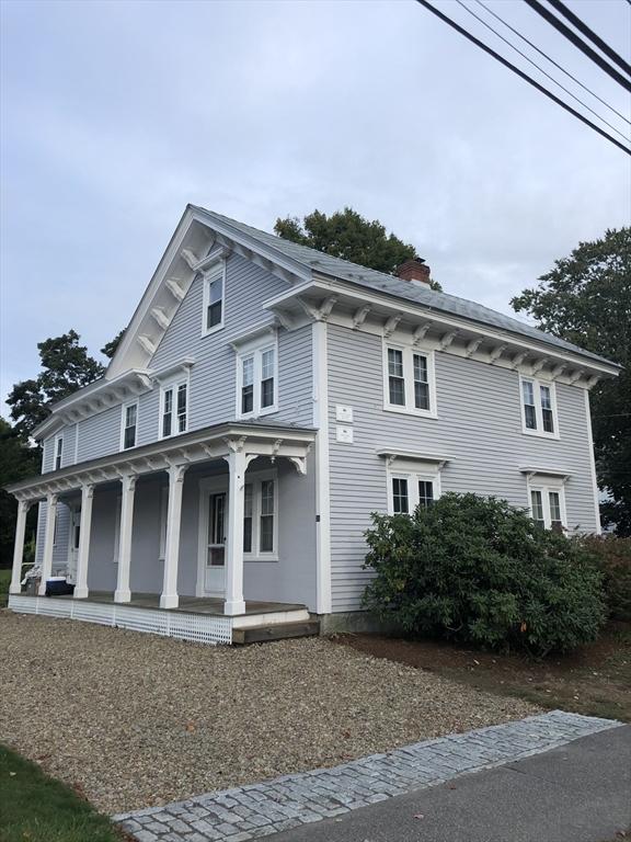 view of front of property with covered porch and a chimney