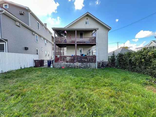 rear view of property with a yard