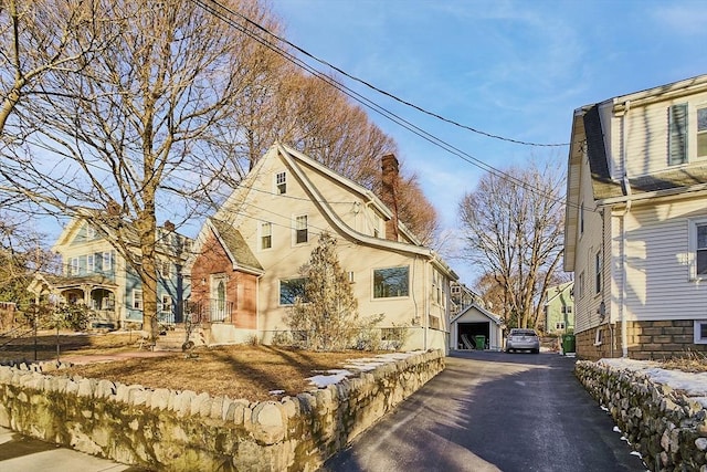 view of side of home featuring a garage