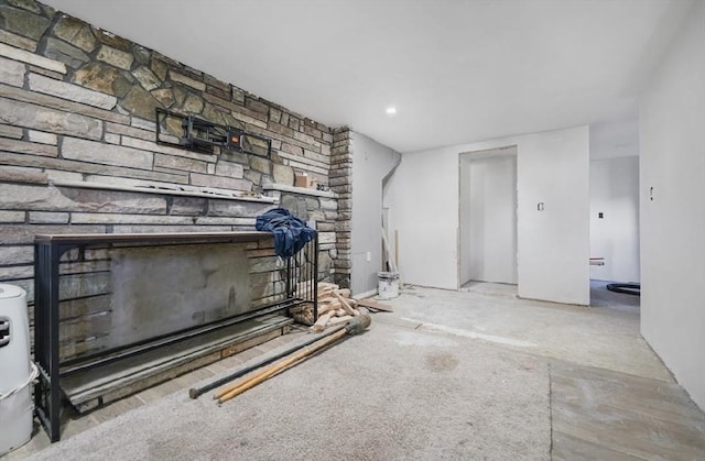 unfurnished living room with a fireplace and recessed lighting