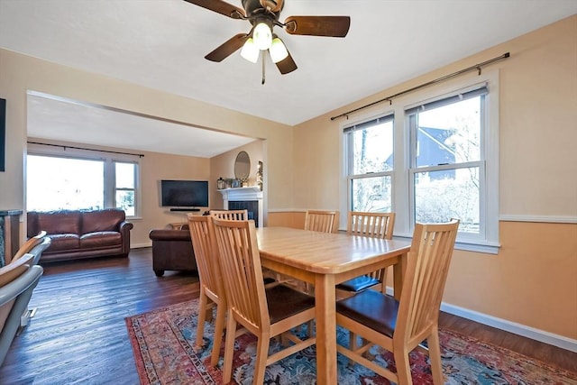 dining room featuring dark hardwood / wood-style flooring and ceiling fan