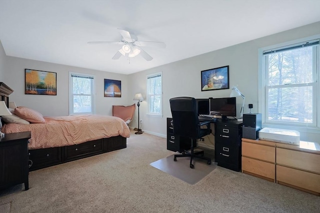 bedroom with ceiling fan and carpet floors