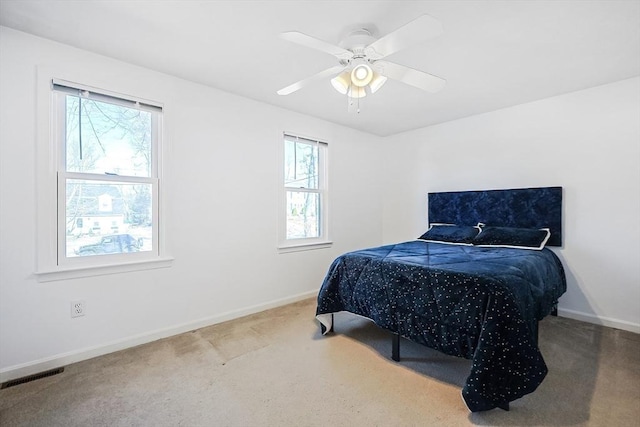 bedroom with ceiling fan and carpet