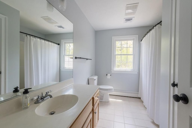 116 Fairview Ln, Plymouth, MA 02360 - bathroom with plenty of natural light, vanity, tile patterned floors, and toilet