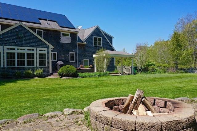 116 Fairview Ln, Plymouth, MA 02360 - back of property with roof mounted solar panels and a yard