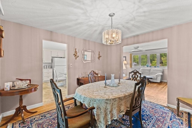 16 Fencourt, Canton, MA 02021 - dining space featuring a chandelier, light wood-style flooring, baseboards, and ceiling fan