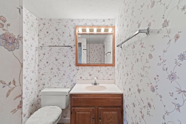 16 Fencourt, Canton, MA 02021 - bathroom featuring wallpapered walls, vanity, and toilet