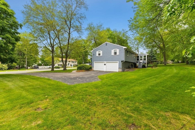16 Fencourt, Canton, MA 02021 - view of home's exterior with a garage, asphalt driveway, and a lawn