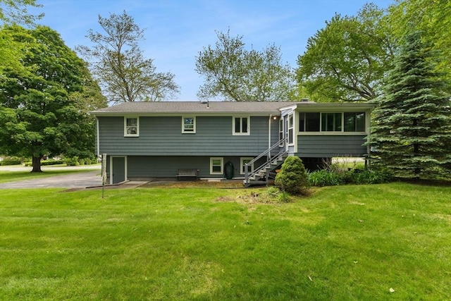 16 Fencourt, Canton, MA 02021 - back of house featuring a sunroom, a yard, and stairs