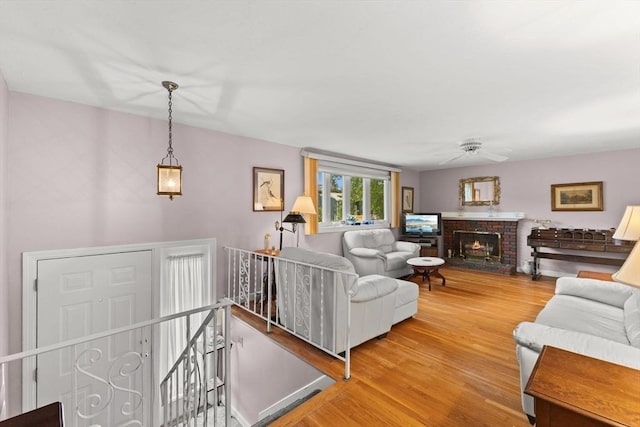 16 Fencourt, Canton, MA 02021 - living area featuring wood finished floors, a ceiling fan, and a brick fireplace