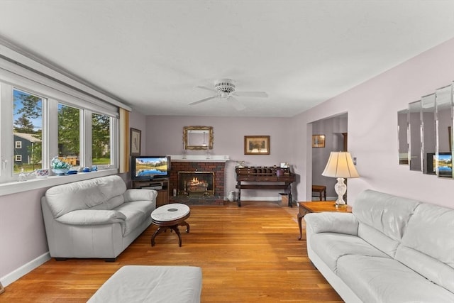 16 Fencourt, Canton, MA 02021 - living area with wood finished floors, a ceiling fan, a brick fireplace, and baseboards