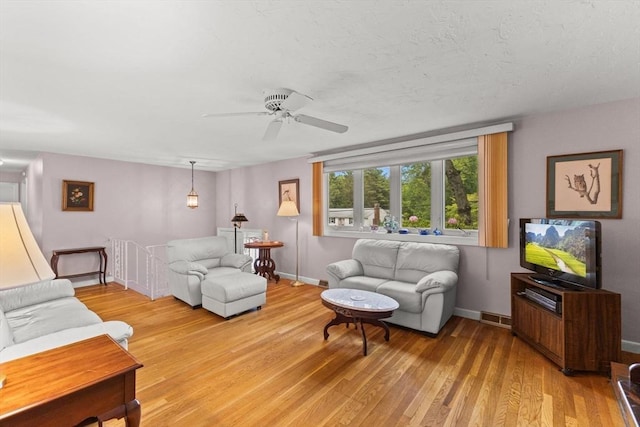16 Fencourt, Canton, MA 02021 - living room featuring light wood-style floors, ceiling fan, and baseboards