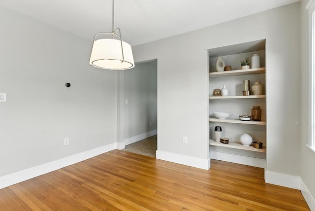 216 Cedar St Unit 3, Somerville, MA 02144 - spare room featuring wood finished floors and built in features