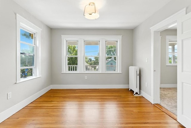 216 Cedar St Unit 3, Somerville, MA 02144 - spare room with radiator and light wood-style floors