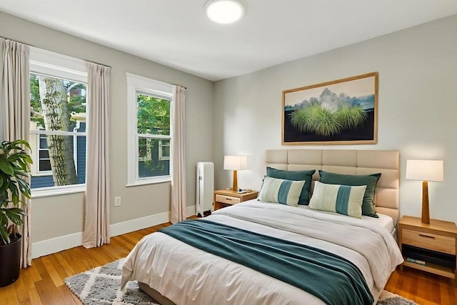216 Cedar St Unit 3, Somerville, MA 02144 - bedroom with baseboards and wood finished floors
