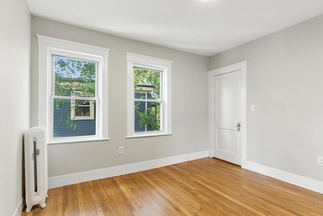 216 Cedar St Unit 3, Somerville, MA 02144 - spare room with radiator and light wood finished floors