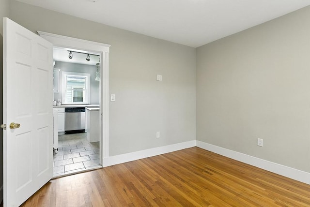216 Cedar St Unit 3, Somerville, MA 02144 - unfurnished room with light wood-type flooring and track lighting