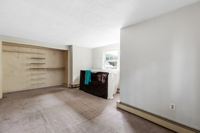 interior space featuring carpet floors and a baseboard radiator