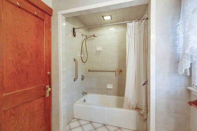 bathroom featuring tile patterned flooring and shower / bathtub combination with curtain