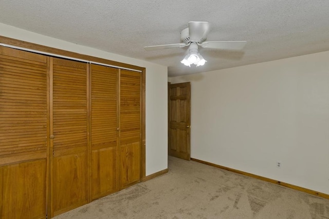 12 Allen St, Chicopee, MA 01020 - unfurnished bedroom featuring a closet, light carpet, a ceiling fan, and a textured ceiling