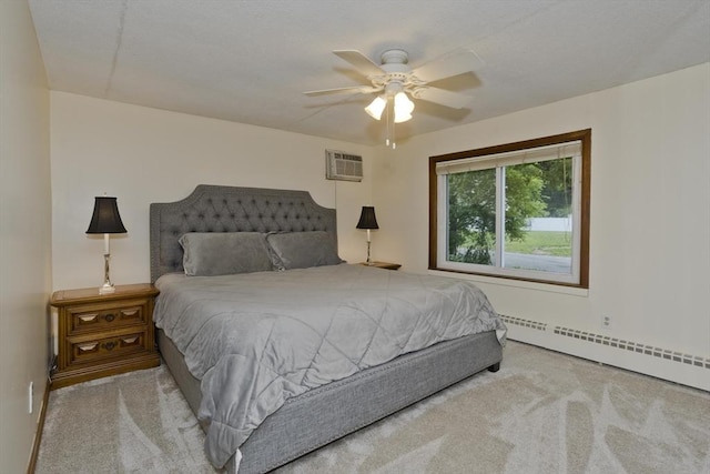 12 Allen St, Chicopee, MA 01020 - carpeted bedroom featuring a wall unit AC, a baseboard heating unit, and ceiling fan