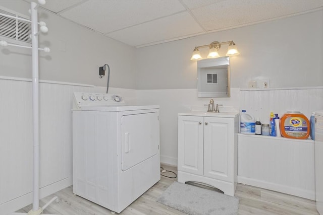 12 Allen St, Chicopee, MA 01020 - bathroom with washer / clothes dryer, a drop ceiling, vanity, wood finished floors, and wainscoting