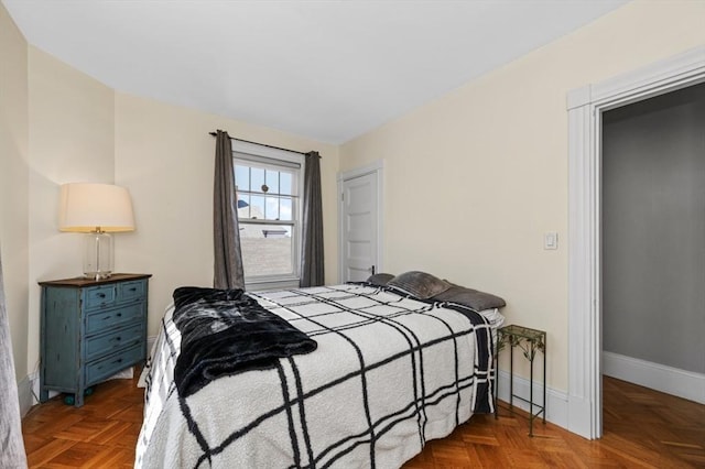 bedroom featuring baseboards