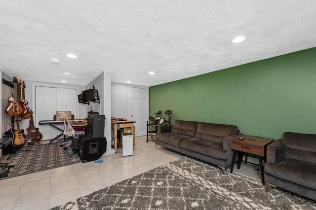 tiled living room with a textured ceiling and recessed lighting