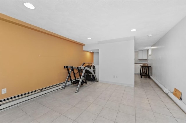 workout room featuring recessed lighting and a baseboard heating unit