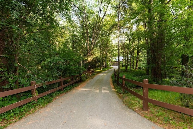 11 Running Stream Rd, Rehoboth, MA 02769 - surrounding community with asphalt driveway and a view of trees