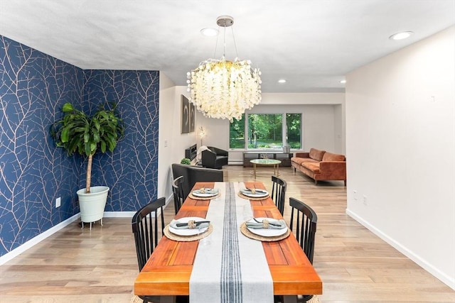 11 Running Stream Rd, Rehoboth, MA 02769 - dining area featuring an accent wall, wallpapered walls, a chandelier, wood finished floors, and recessed lighting