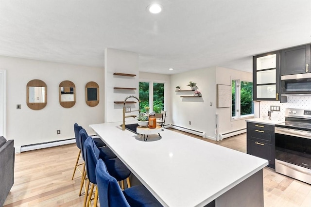 11 Running Stream Rd, Rehoboth, MA 02769 - kitchen featuring stainless steel appliances, baseboard heating, light countertops, and recessed lighting