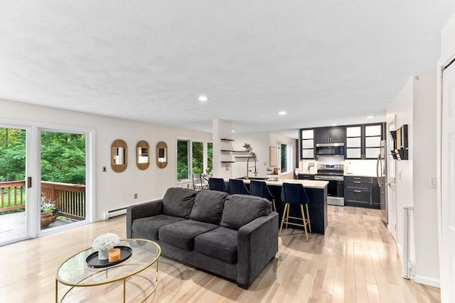 11 Running Stream Rd, Rehoboth, MA 02769 - living room with healthy amount of natural light, light wood-style floors, a baseboard heating unit, and recessed lighting