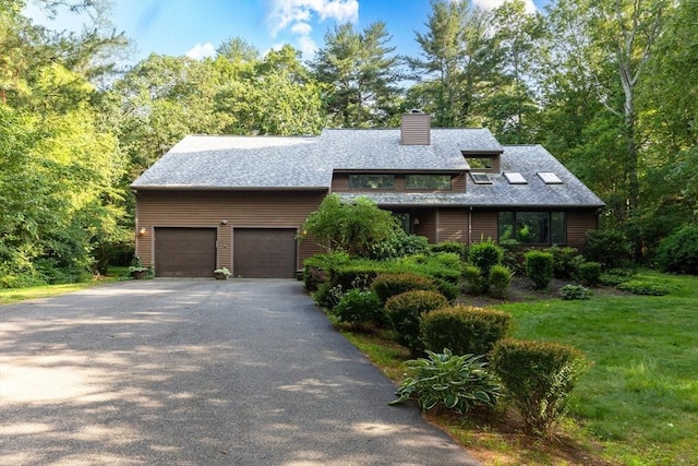 11 Running Stream Rd, Rehoboth, MA 02769 - view of front of house featuring a chimney, asphalt driveway, and a front lawn