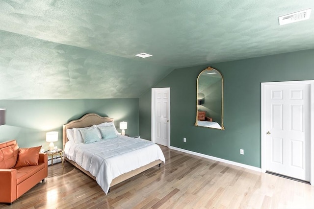 11 Running Stream Rd, Rehoboth, MA 02769 - bedroom with wood finished floors, a textured ceiling, and vaulted ceiling