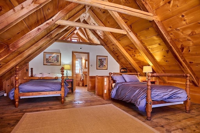 bedroom featuring hardwood / wood-style floors, lofted ceiling with beams, and wood ceiling