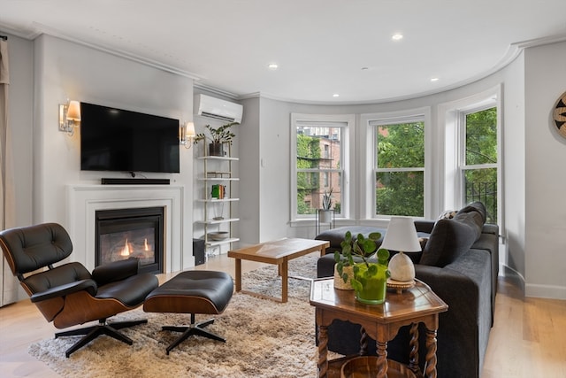 living room featuring crown molding, a wall unit AC, and light hardwood / wood-style floors