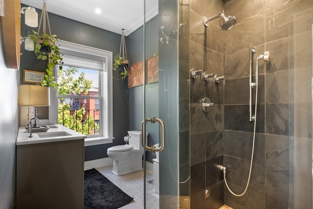 bathroom with vanity, toilet, tile patterned floors, and a shower with door