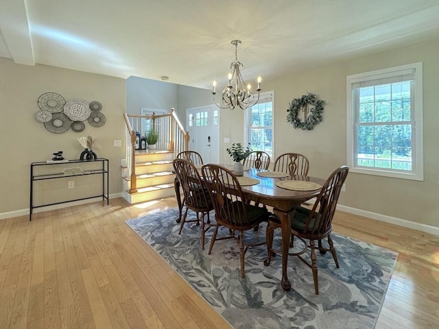 111 Country Club Pl, Southbridge, MA 01550 - dining room with stairway, a chandelier, and light wood-type flooring