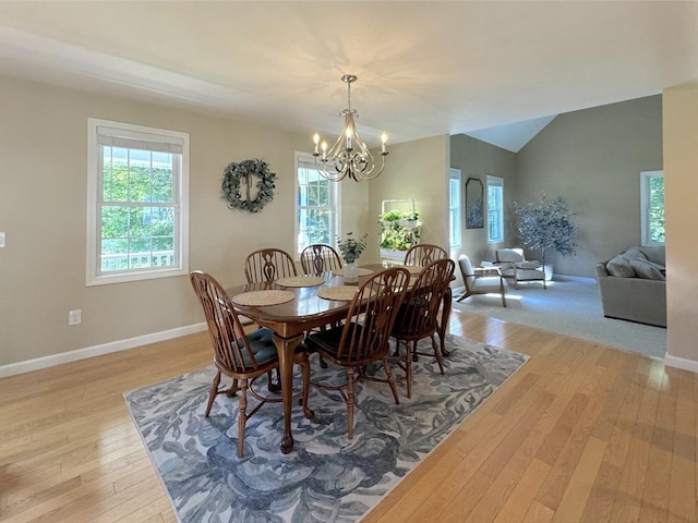111 Country Club Pl, Southbridge, MA 01550 - dining area with a chandelier, light wood-type flooring, and vaulted ceiling