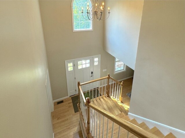 111 Country Club Pl, Southbridge, MA 01550 - foyer entrance with a chandelier, wood finished floors, healthy amount of natural light, and a towering ceiling