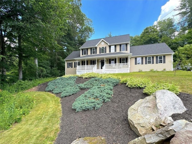 111 Country Club Pl, Southbridge, MA 01550 - colonial-style house featuring a porch and a front lawn