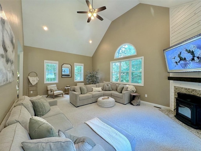 111 Country Club Pl, Southbridge, MA 01550 - carpeted living area featuring high vaulted ceiling, ceiling fan, healthy amount of natural light, a wood stove, and recessed lighting