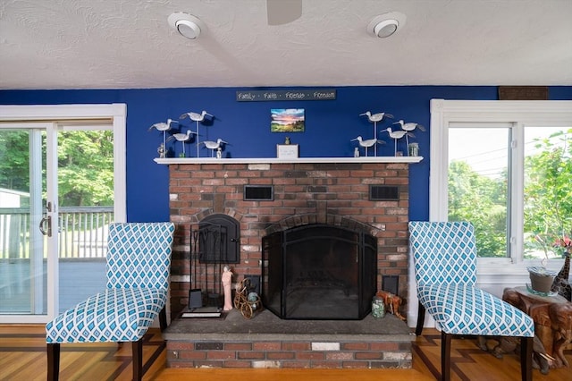 29 Wituwamat Rd, Weymouth, MA 02191 - living room with a fireplace and a textured ceiling