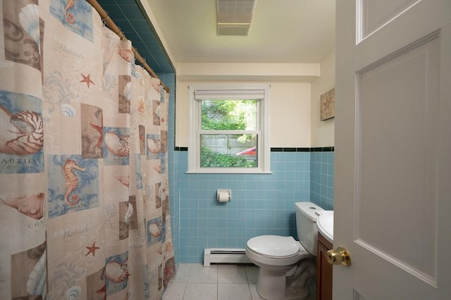 29 Wituwamat Rd, Weymouth, MA 02191 - bathroom featuring baseboard heating, tile patterned floors, tile walls, toilet, and vanity