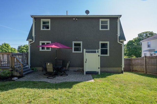 29 Wituwamat Rd, Weymouth, MA 02191 - rear view of property with a patio