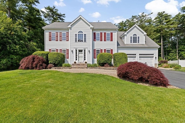 102 Saddleworth Way, Middleboro, MA 02346 - colonial home with asphalt driveway, a front yard, and a garage