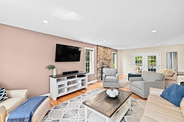 102 Saddleworth Way, Middleboro, MA 02346 - living room featuring recessed lighting, light wood finished floors, a fireplace, and french doors